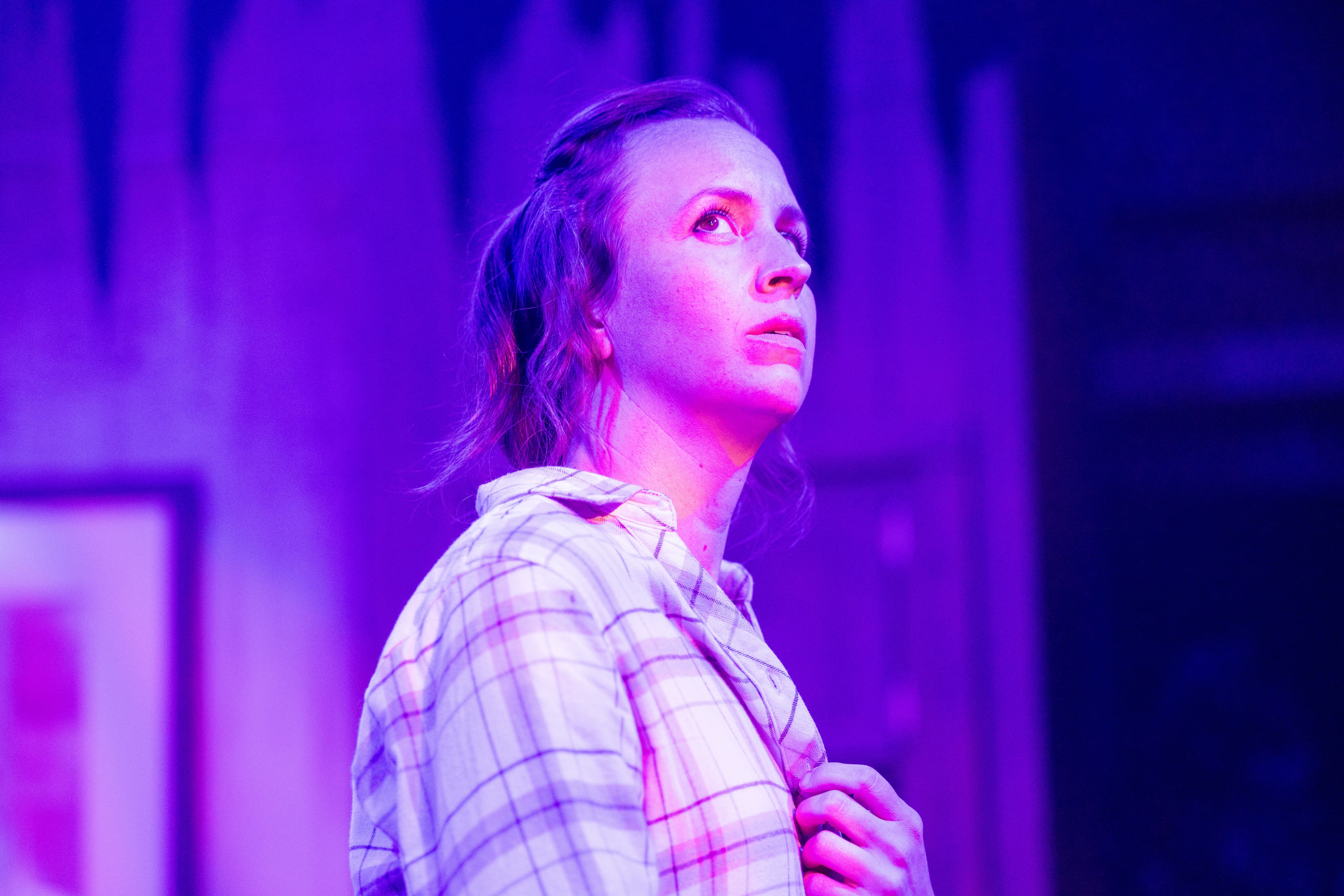 Rachel Hancock as Max in the wolf you feed — close-up in purple light