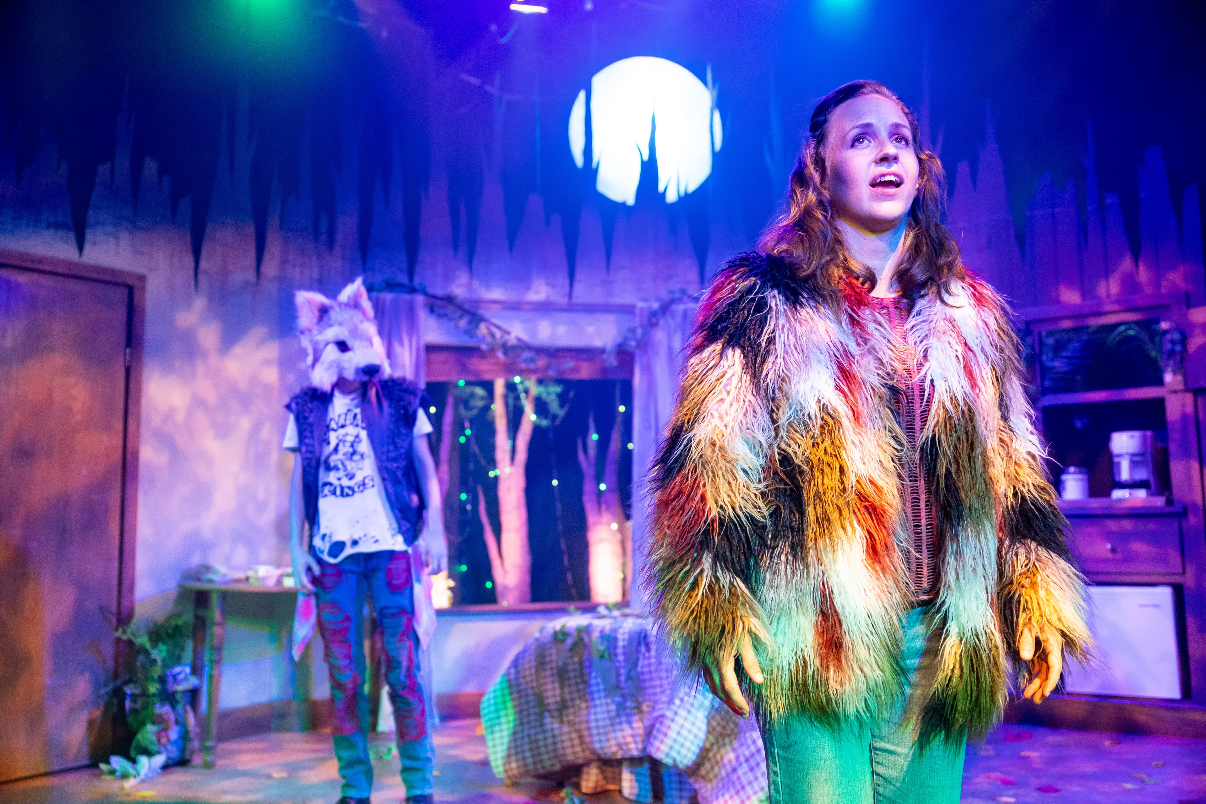 Rachel Hancock as Max in the wolf you feed — rainbow fur coat under moonlight