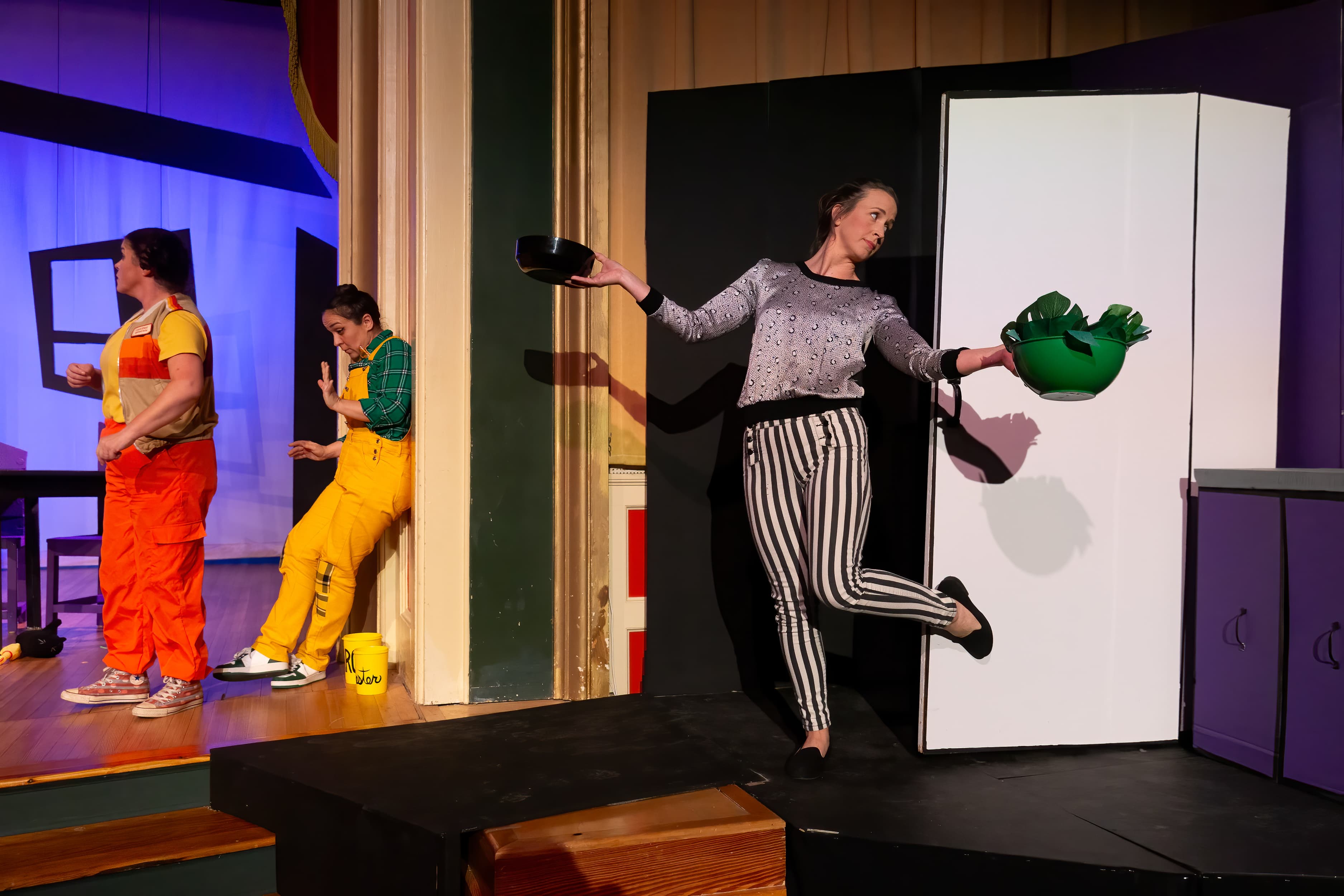 Rachel Hancock in comedy production — running with props