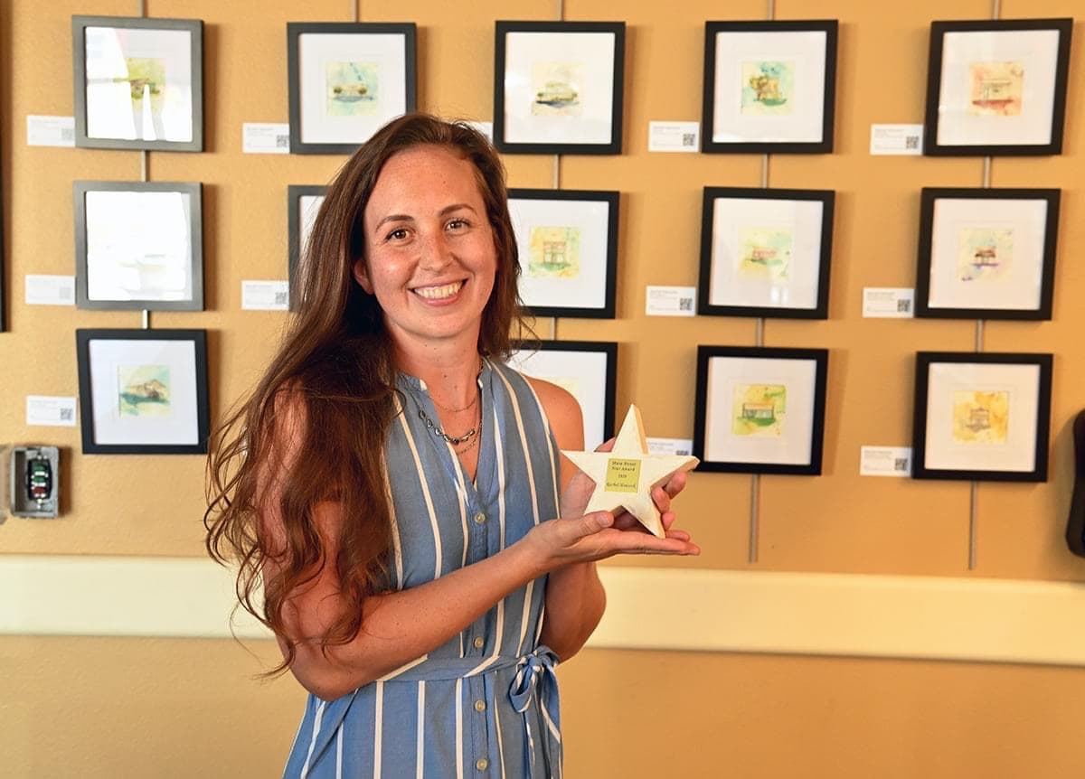 Rachel with her star award at the Art with Heart exhibition